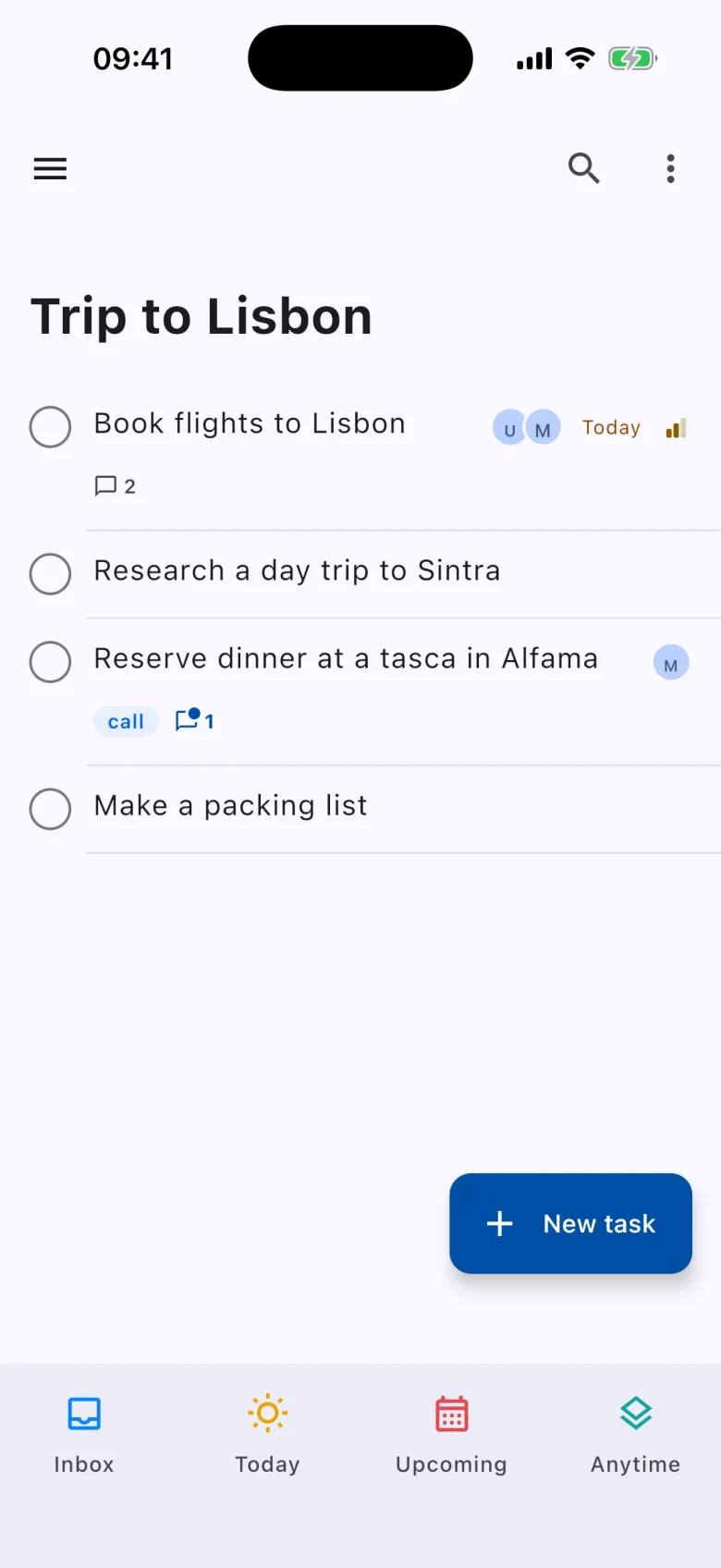 A shared project on iPhone: Trip to Lisbon with avatars of who is assigned and comment counts.